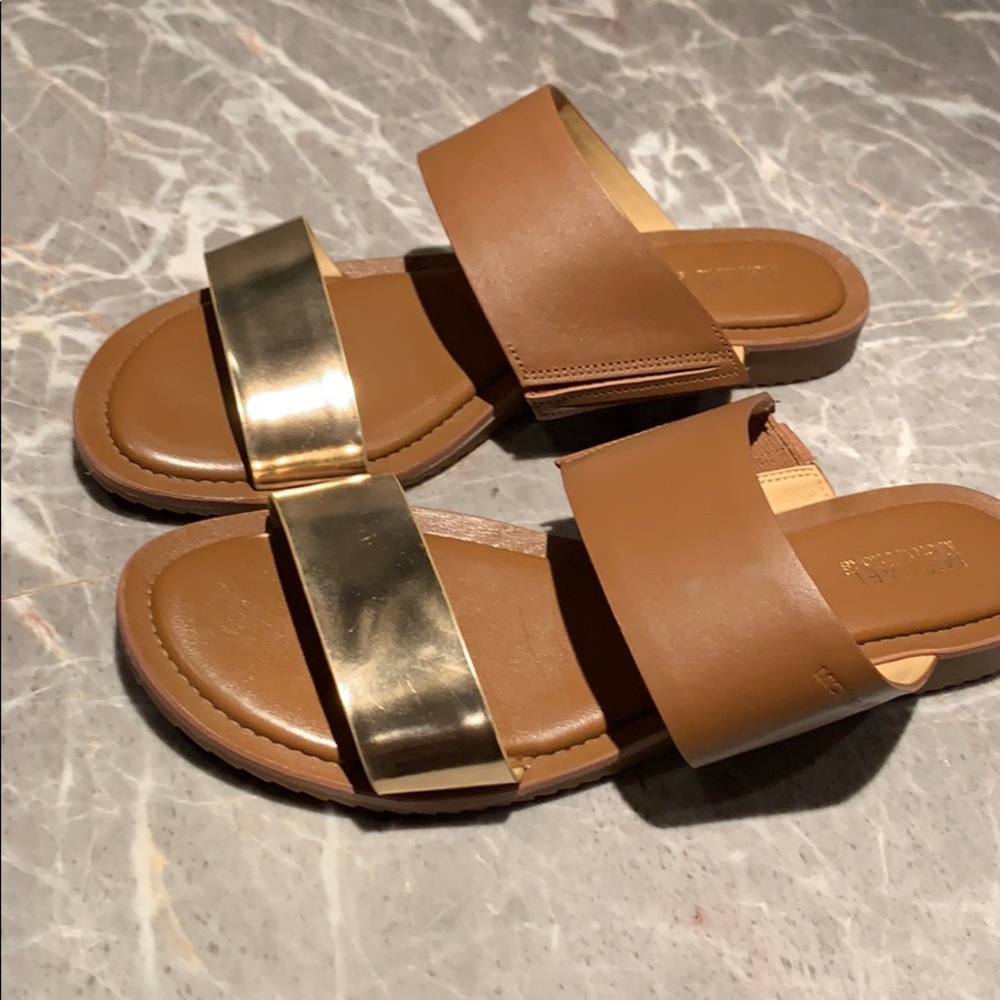 Michael Kors brown and gold flat padded sandal.